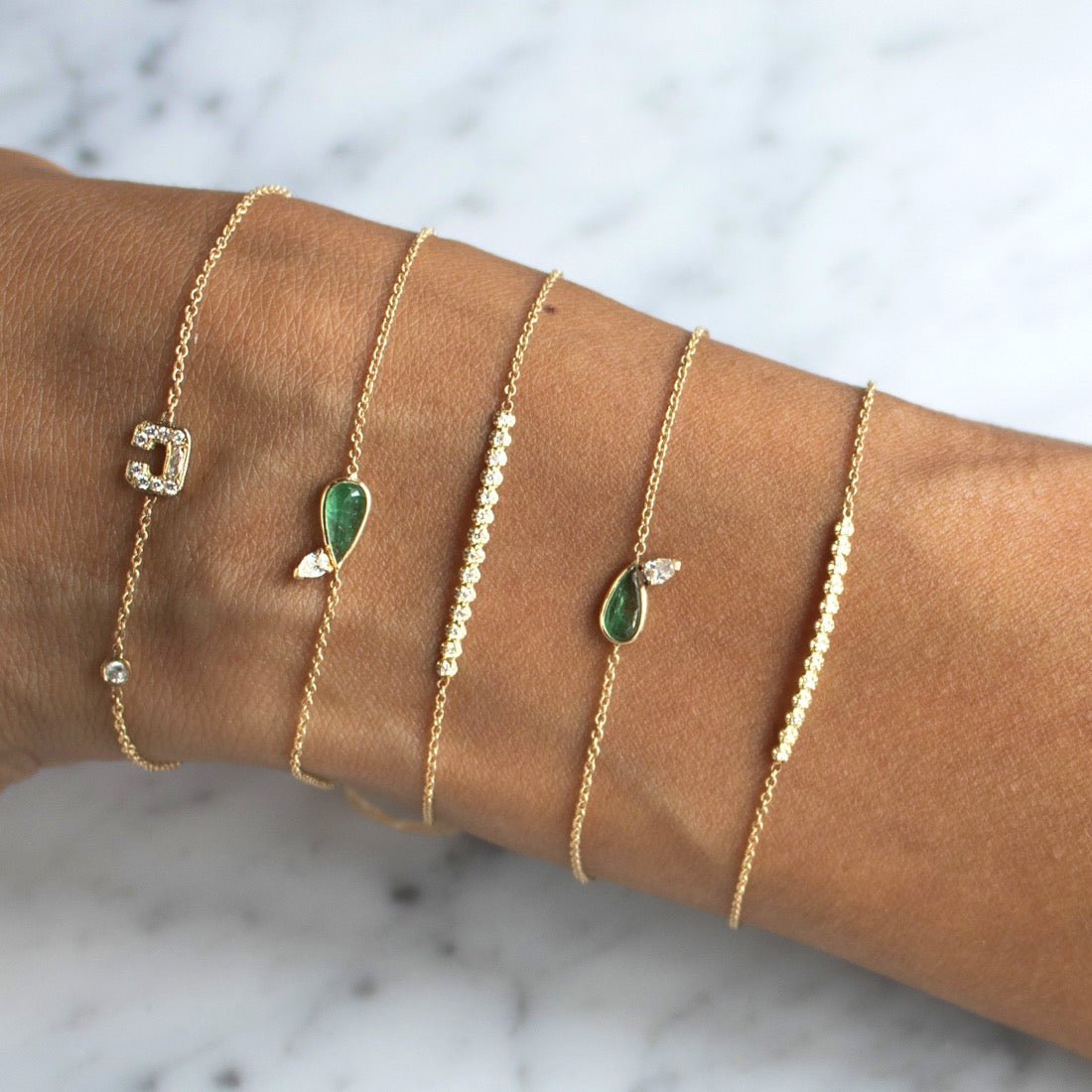 Diamond Bar Bracelet – 14K Gold Pavé Fine Jewelry on models arm with other bracelets - Camille Jewelry