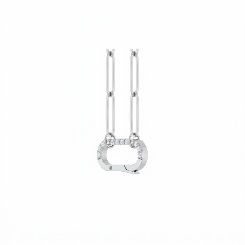 Diamond charm holder necklace in 14K yellow gold with a pavé set hinged clip on a paperclip chain on a white background angled view by Camille Jewelry