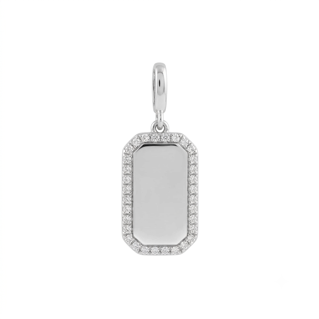 Back view of a diamond dog tag charm in 14K white gold engraved with an initial by Camille Jewelry