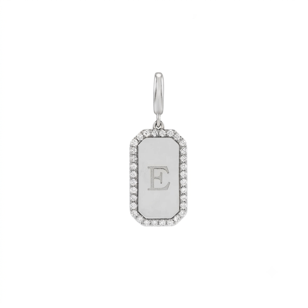 Engravable diamond dog tag charm in 14K white gold with a natural diamond halo border on a white background by Camille Jewelry