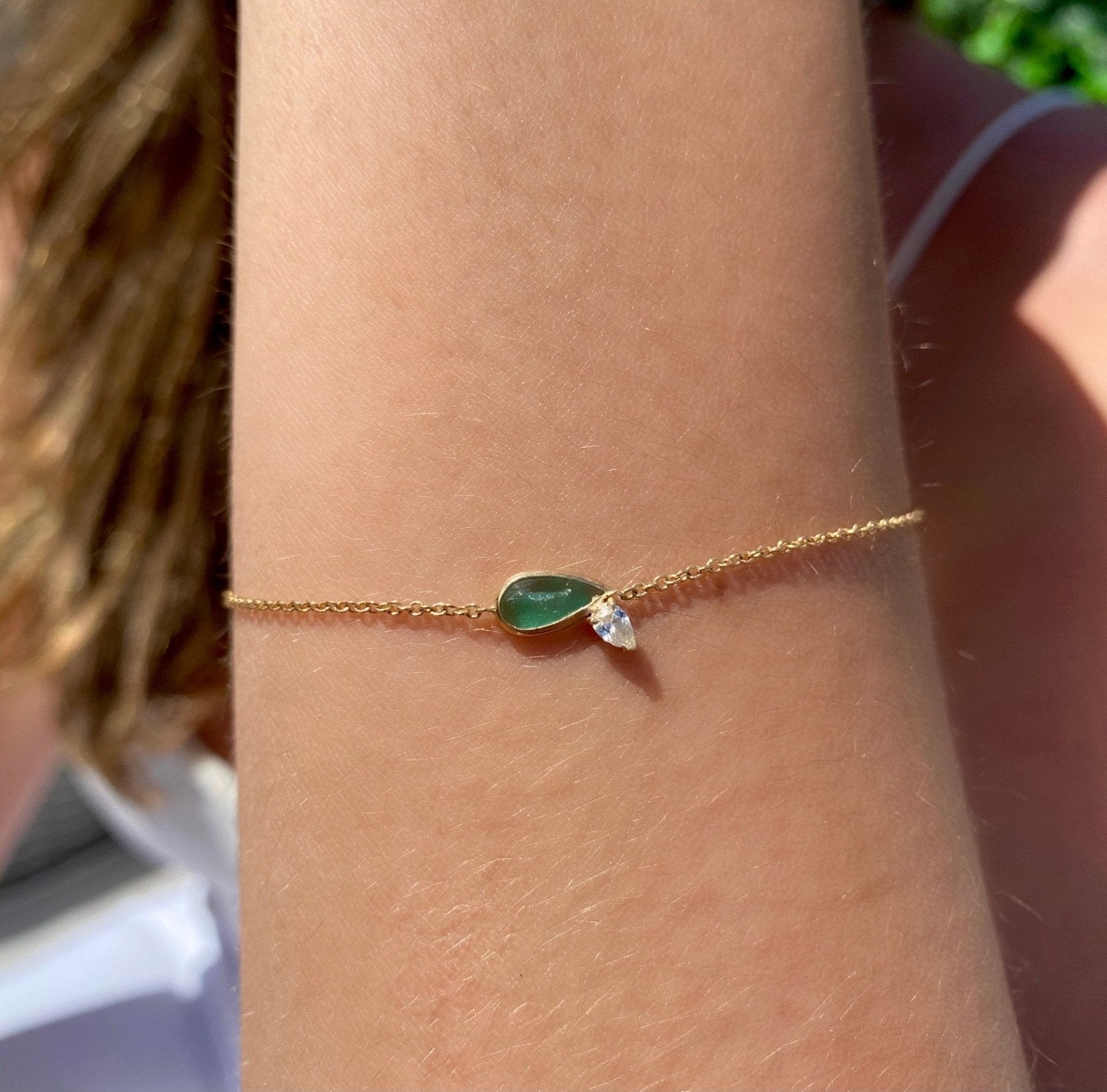 Diamond Emerald Bracelet – 14K Gold pear shaped Jewelry on models wrist- Camille Jewelry
