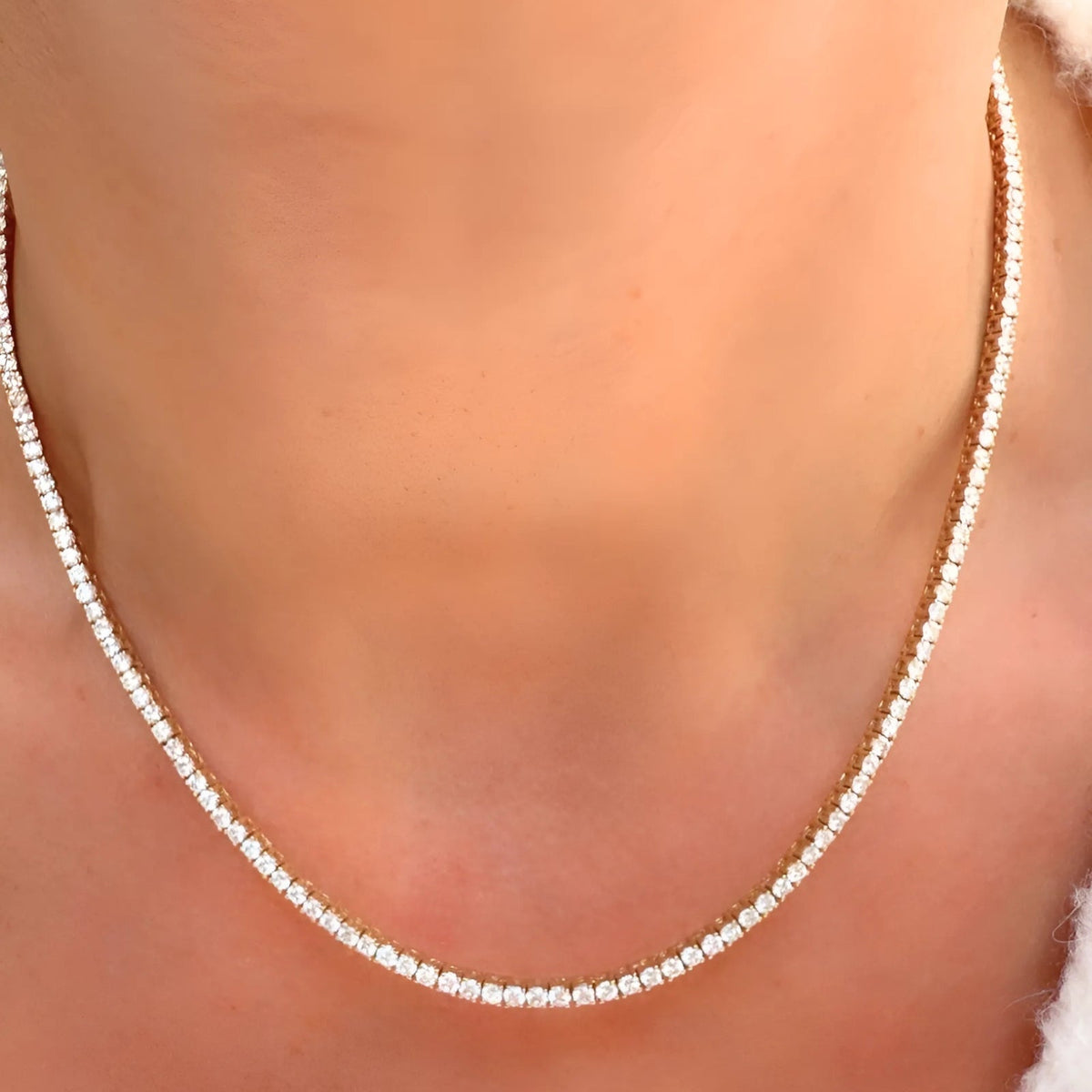 Diamond Tennis Necklace | 5.87 CTW Lab-Created or Natural Diamonds on a models neckline - Camille Jewelry