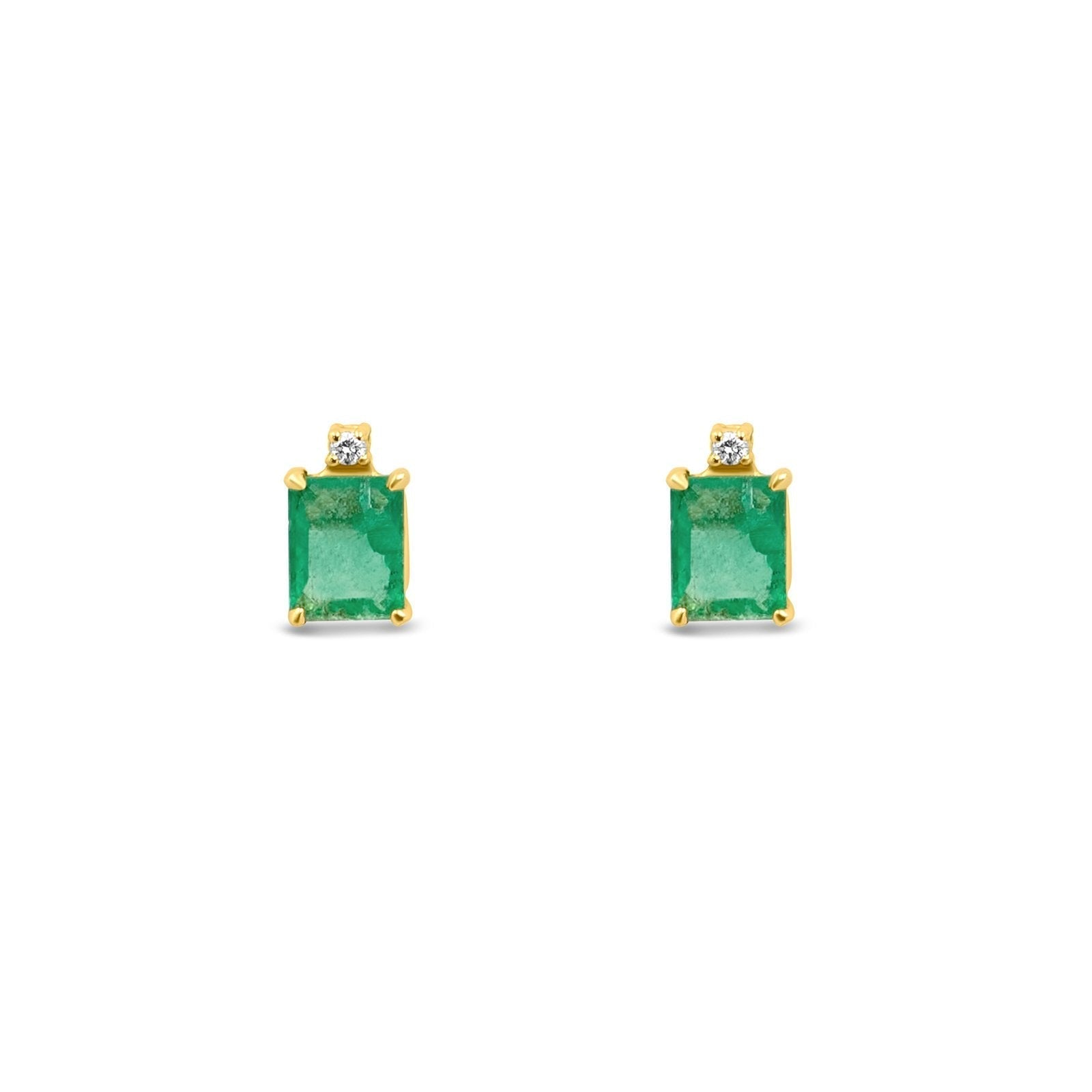 Emerald Stud Earrings with a diamond accent on a white background - Camille Jewelry