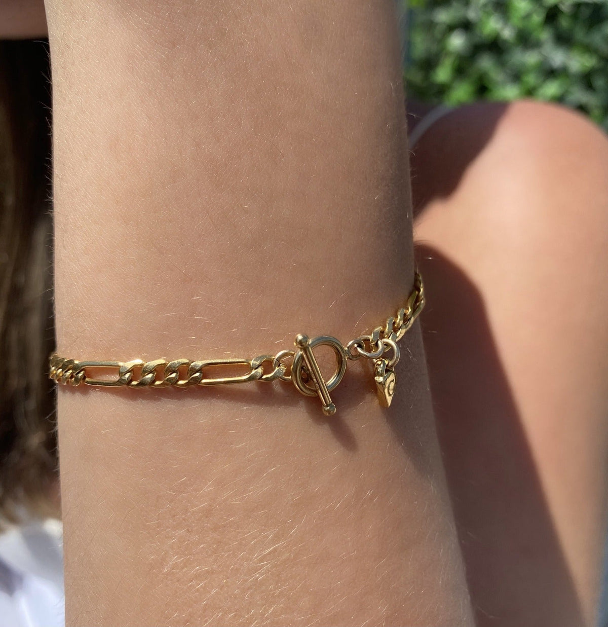 3.5mm Gold-Filled Figaro Chain Bracelet – Timeless Elegance with Toggle Closure on models wrist- Camille Jewelry