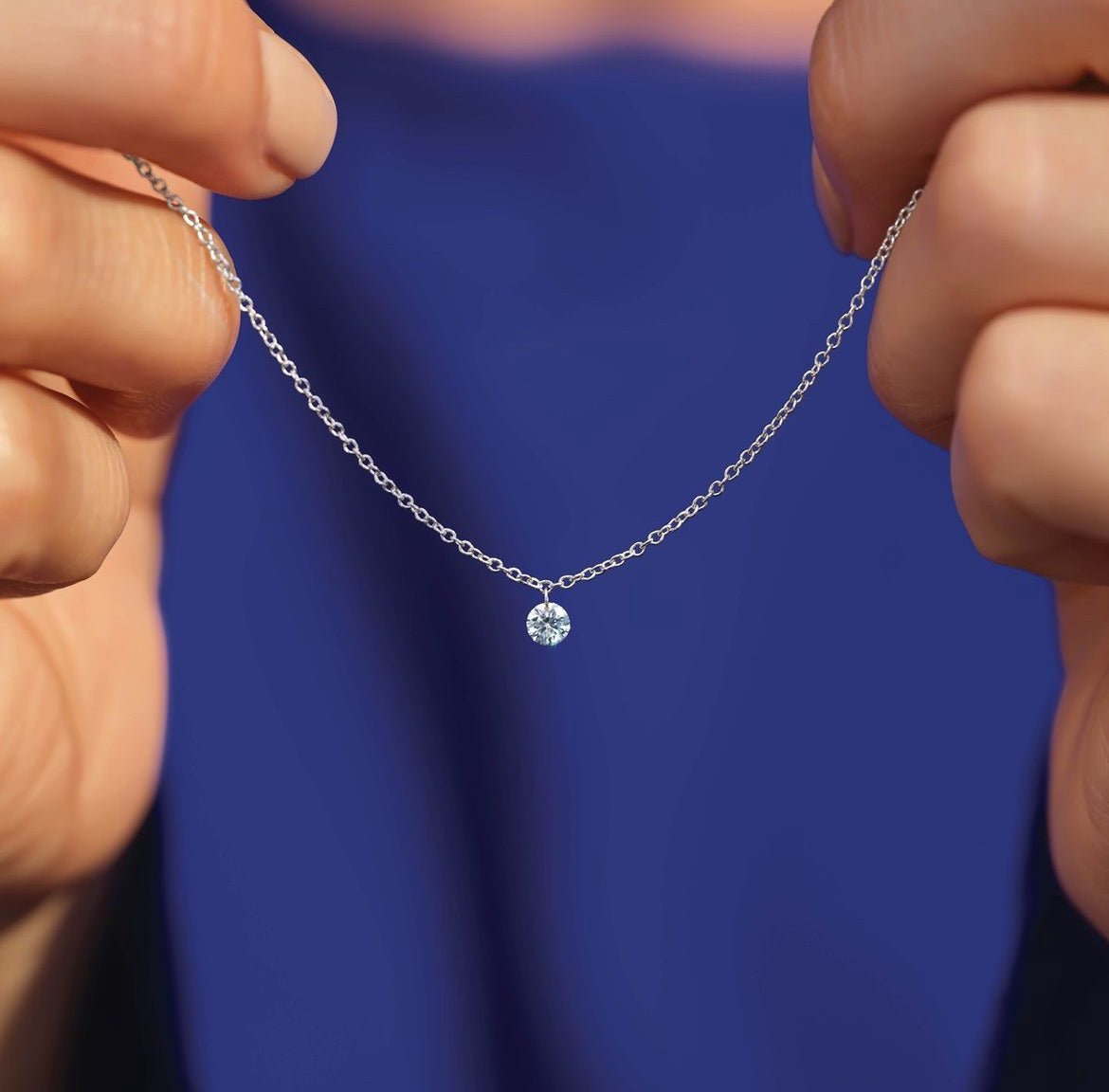 14K yellow gold Drilled Diamond Necklace held up my models hands- Camille Jewelry