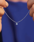 14K yellow gold Drilled Diamond Necklace held up my models hands- Camille Jewelry