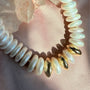 Close up of hand knotted freshwater pearls and 14K gold filled sphere beads on silk thread by Camille Jewelry