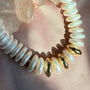 Close up of hand knotted freshwater pearls and 14K gold filled sphere beads on silk thread by Camille Jewelry