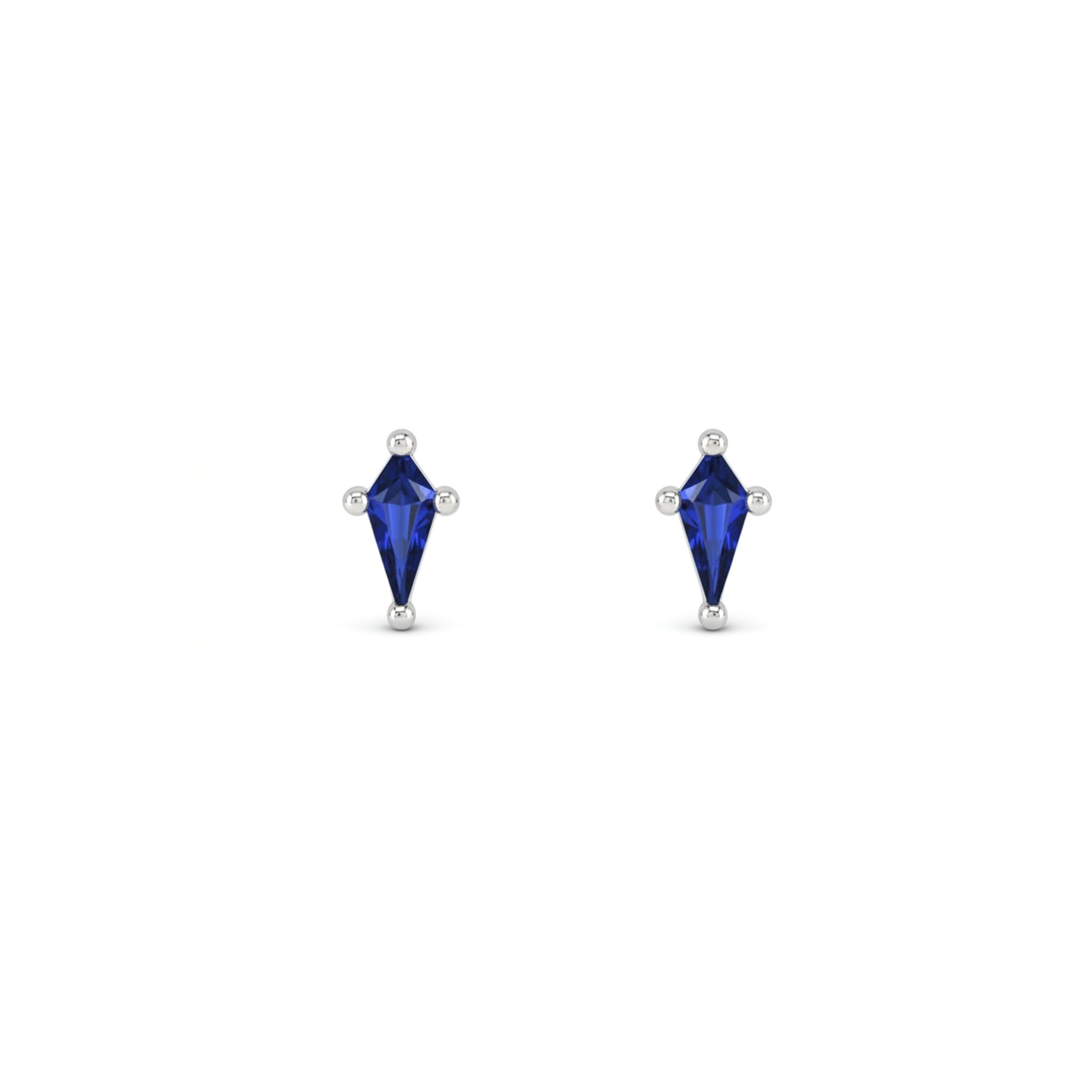 Kite cut lab created sapphire stud earrings in 14K white gold on a white background by Camille Jewelry