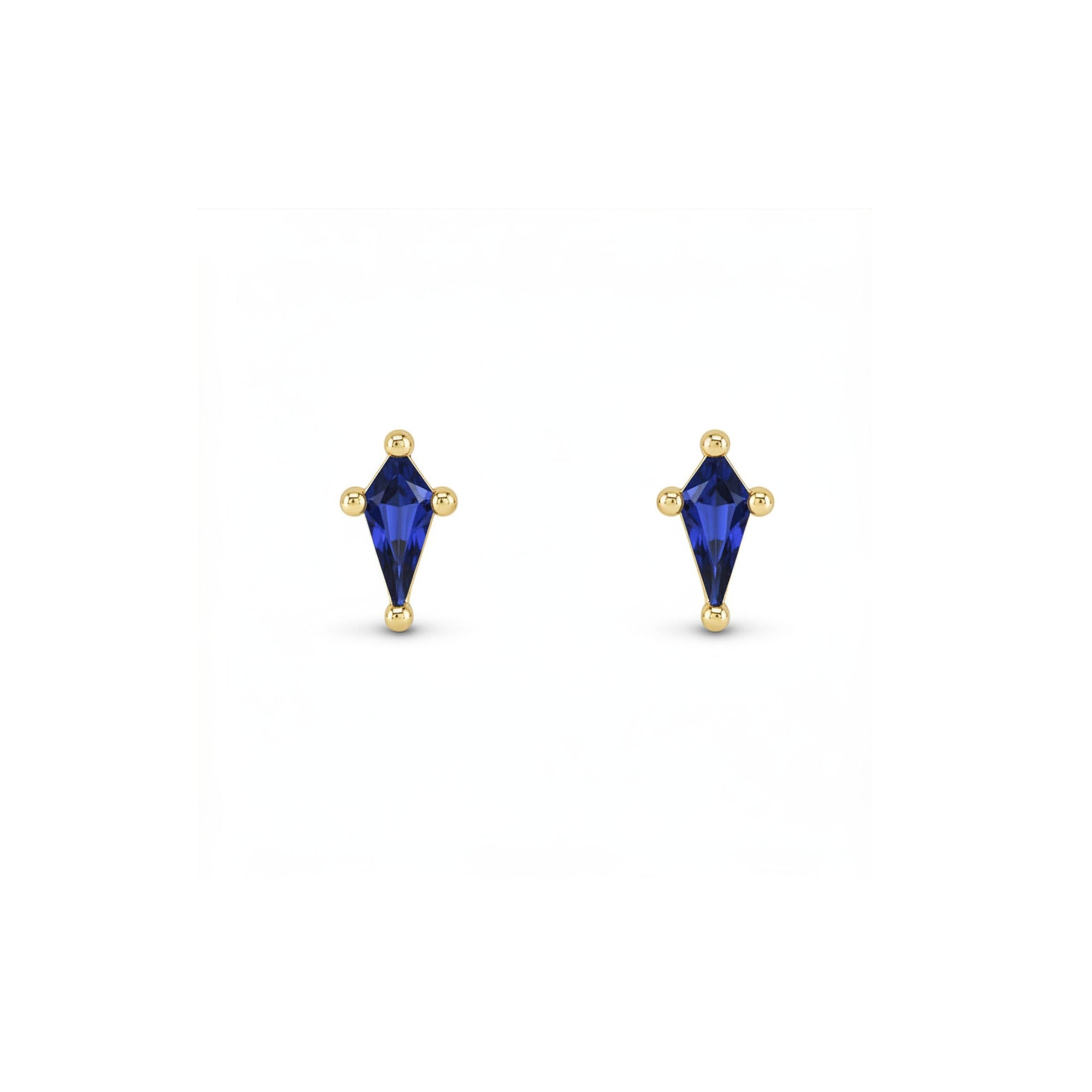 Kite cut lab created sapphire stud earrings in 14K yellow gold on a white background by Camille Jewelry