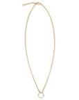 Gold circle necklace in 14K gold filled with bezel set cubic zirconia pendant on a white background by Camille Jewelry
