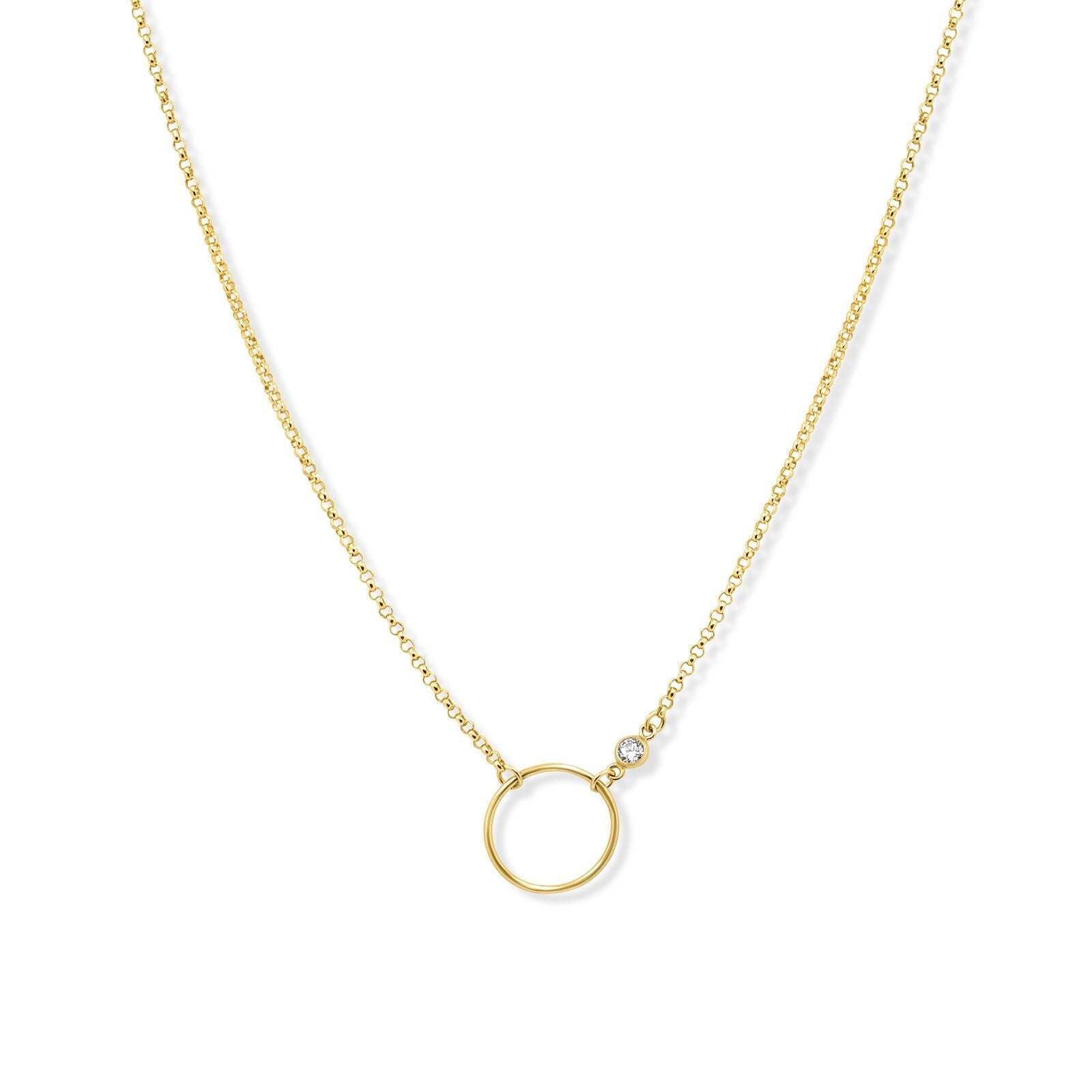 Gold circle necklace in 14K gold filled with bezel set cubic zirconia pendant on a white background by Camille Jewelry