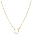 Gold circle necklace in 14K gold filled with bezel set cubic zirconia pendant on a white background by Camille Jewelry