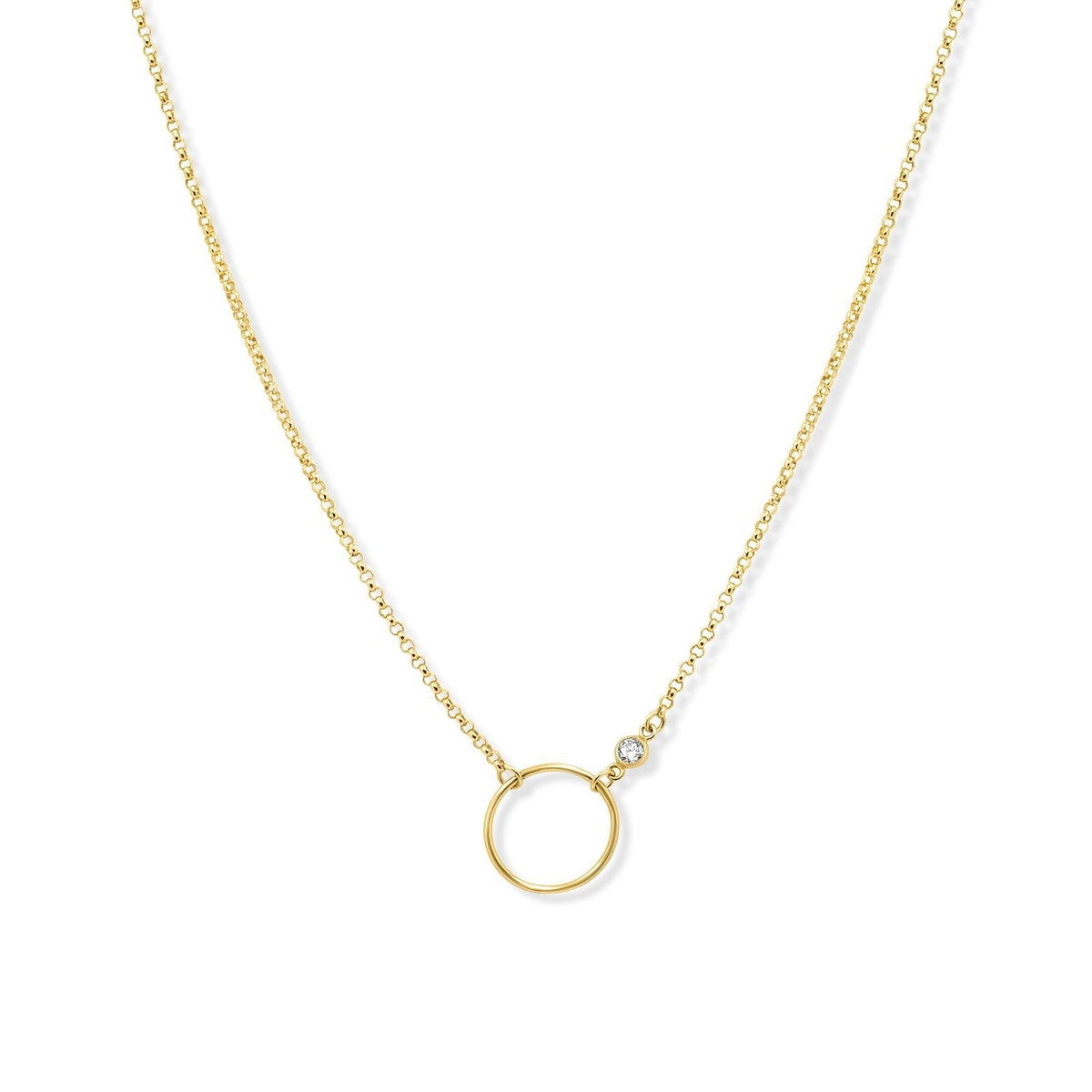 Gold circle necklace in 14K gold filled with bezel set cubic zirconia pendant on a white background by Camille Jewelry
