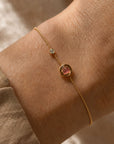 Gold filled bracelet rounded box chain with an organic tourmaline gemstone and CZ accent on wrist by Camille Jewelry. 