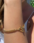 Gold Filled Curb Chain Toggle Bar Bracelet on models arm by Camille Jewelry