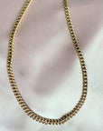  gold filled curb chain link necklace in 14K gold filled on soft pink cloth by Camille Jewelry