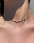 Gold Filled Medium Elongated Curb Chain Necklace on models neckline by Camille Jewelry