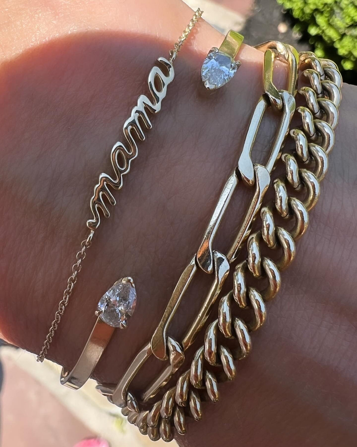 14K yellow gold petite script Mama Bracelet with other chain styles on model- Camille Jewelry