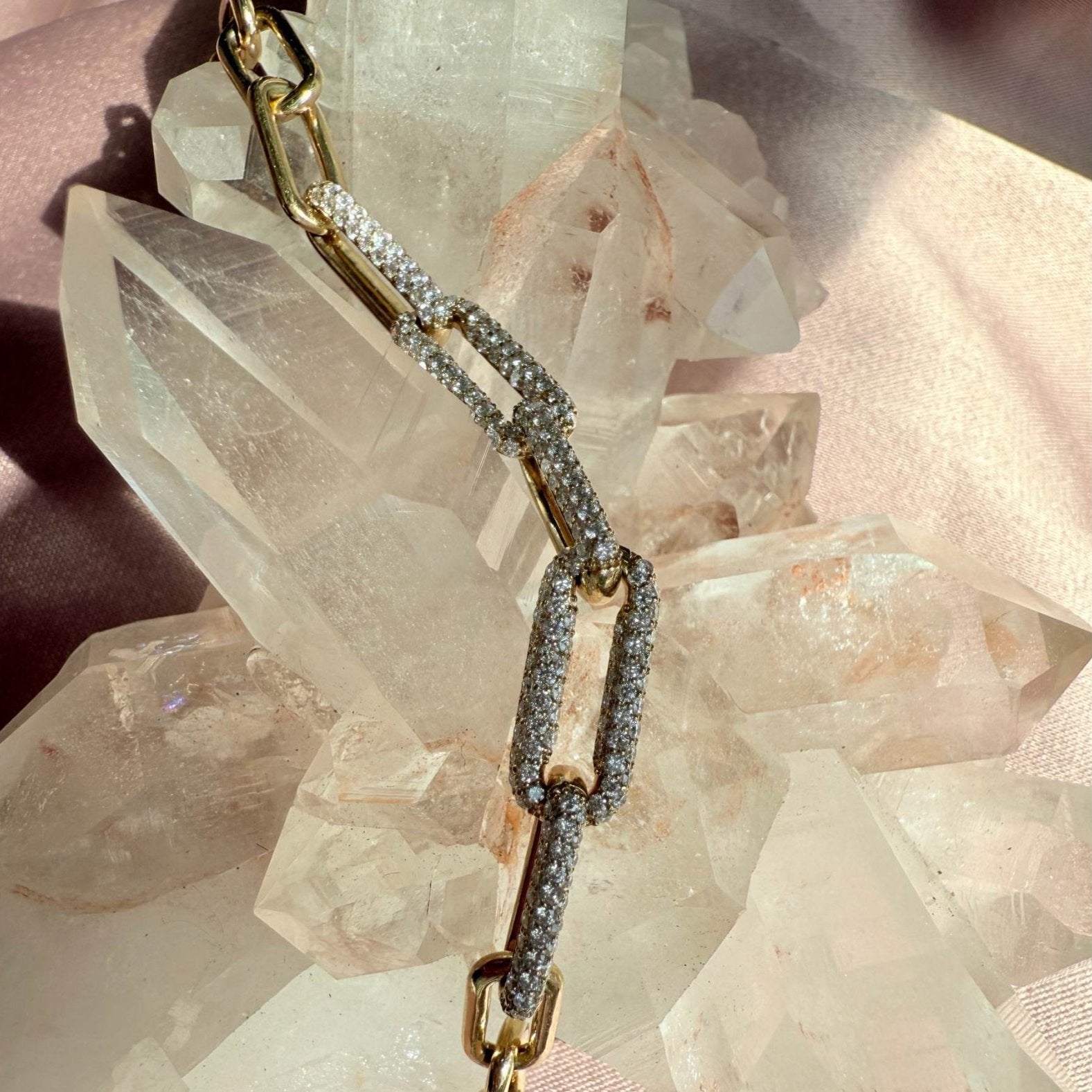 14K Yellow Gold Paperclip Bracelet with 1.5 CTW Lab Grown Diamonds on a quartz background for Camille Jewelry