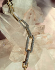 14K Yellow Gold Paperclip Bracelet with 1.5 CTW Lab Grown Diamonds on a quartz background for Camille Jewelry