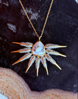 Pendant with wing Phoenix jewelry necklace design on a dark stone background by Camille Jewelry