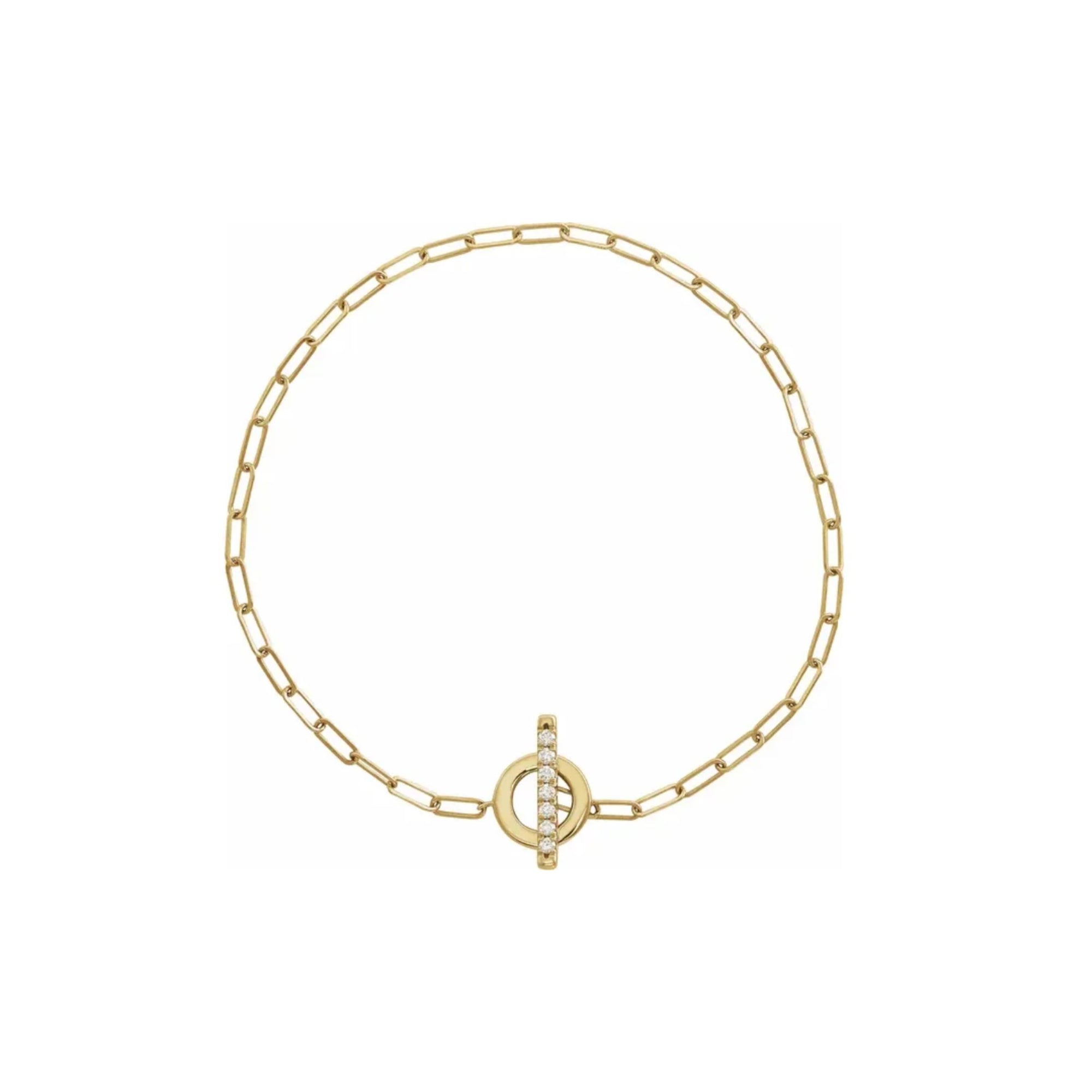 Gold toggle bracelet in 14K yellow gold with diamond set bar on a white background by Camille Jewelry