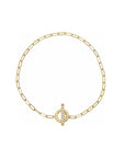 Gold toggle bracelet in 14K yellow gold with diamond set bar on a white background by Camille Jewelry