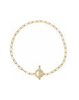 Gold toggle bracelet in 14K yellow gold with diamond set bar on a white background by Camille Jewelry
