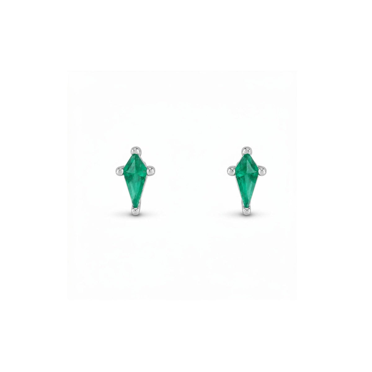 Kite cut lab created emerald stud earrings in 14K white gold on a white background by Camille Jewelry