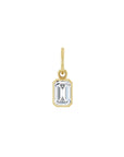Lab grown diamond charm in 14K yellow gold with a bezel set stone on a white background by Camille Jewelry