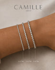 Three lab grown diamond tennis bracelets in 14K white gold worn on a wrist, showing 2 CTW, 3 CTW, and 5 CTW size comparison by Camille Jewelry
