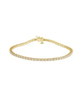Lab grown diamond tennis bracelet in 14K yellow gold on a white background by Camille Jewelry