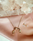 Magnetic convertible bar chain clasp necklace in gold plated brass on a white background by Camille Jewelry