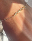 14K yellow gold petite script Mama Bracelet on model- Camille Jewelry
