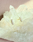 Mini Diamond Bar Stud Earrings on a quartz background by Camille Jewelry