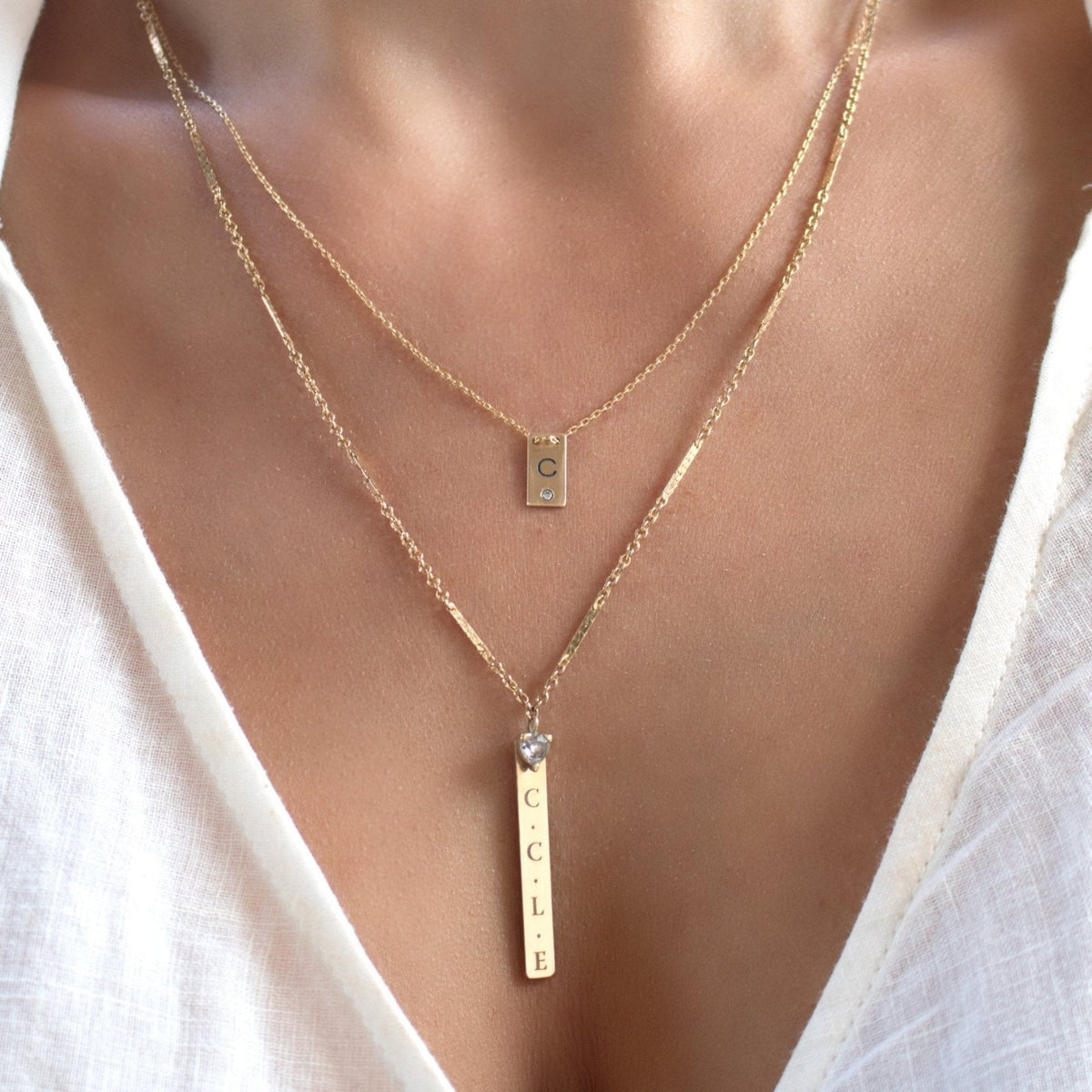 14K gold filled Mini Plaque Personalized Necklace with other chain styles on a models neck- Camille Jewelry