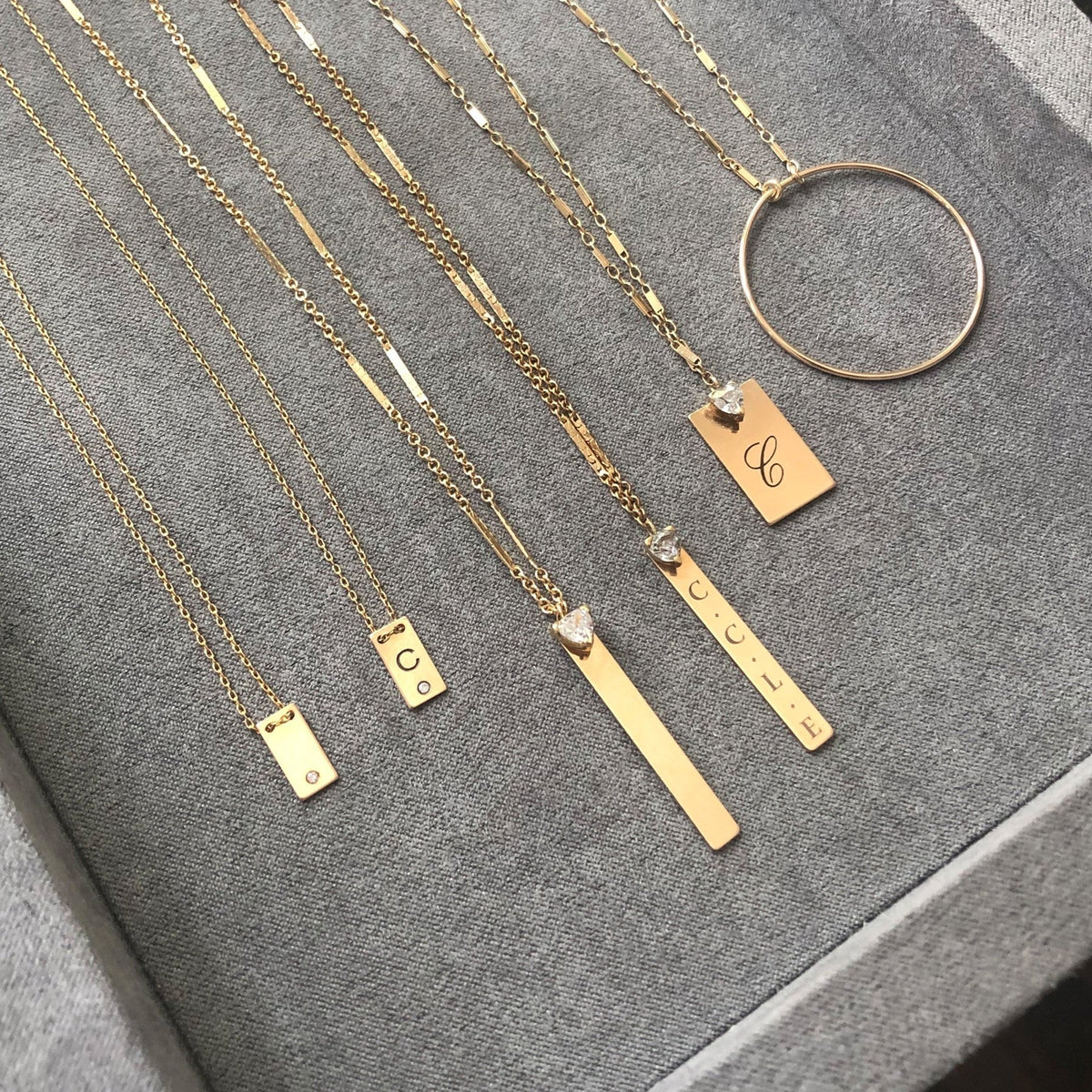 14K gold filled Plaque Personalized Necklaces on a gray background - Camille Jewelry