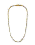 Modern tennis necklace in gold plated sterling silver with cubic zirconia on a white background by Camille Jewelry