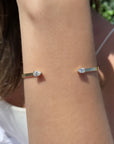Open Cuff Bracelet | Pear-Shaped Diamond Bangle in 14K Yellow Gold on white background- Camille Jewelry