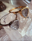 Gold & Silver Trillion Stackable Rings on a quartz display– Concave Pavé Everyday Bands - Camille Jewelry