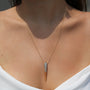 Large cubic zirconia bird beak necklace inspired by the Phoenix on a woman's necklace from Camille Jewelry