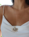 Wing Phoenix necklace on a woman wearing a white blouse from Camille Jewelry