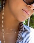 Model wearing convertible gold paperclip chain necklace with sunglasses | Camille Jewelry