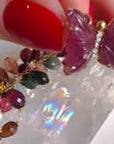 Video featuring pink hand carved tourmaline butterfly with diamond center in 14K yellow gold | Camille Jewelry