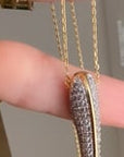 Video of Phoenix large pave bird beak with cubic zirconia pave detailing on long chain | Camille Jewelry