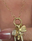 Diamond,personalized gold charms on models neckline by Camille Jewelry
