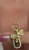 Diamond,personalized gold charms on models neckline by Camille Jewelry