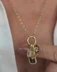 gold charm necklace and holder in diamonds and personalization by Camille Jewelry.