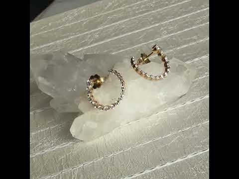 Graduated lab created Diamond Front hoop earrings on a leather display for Camille Jewelry